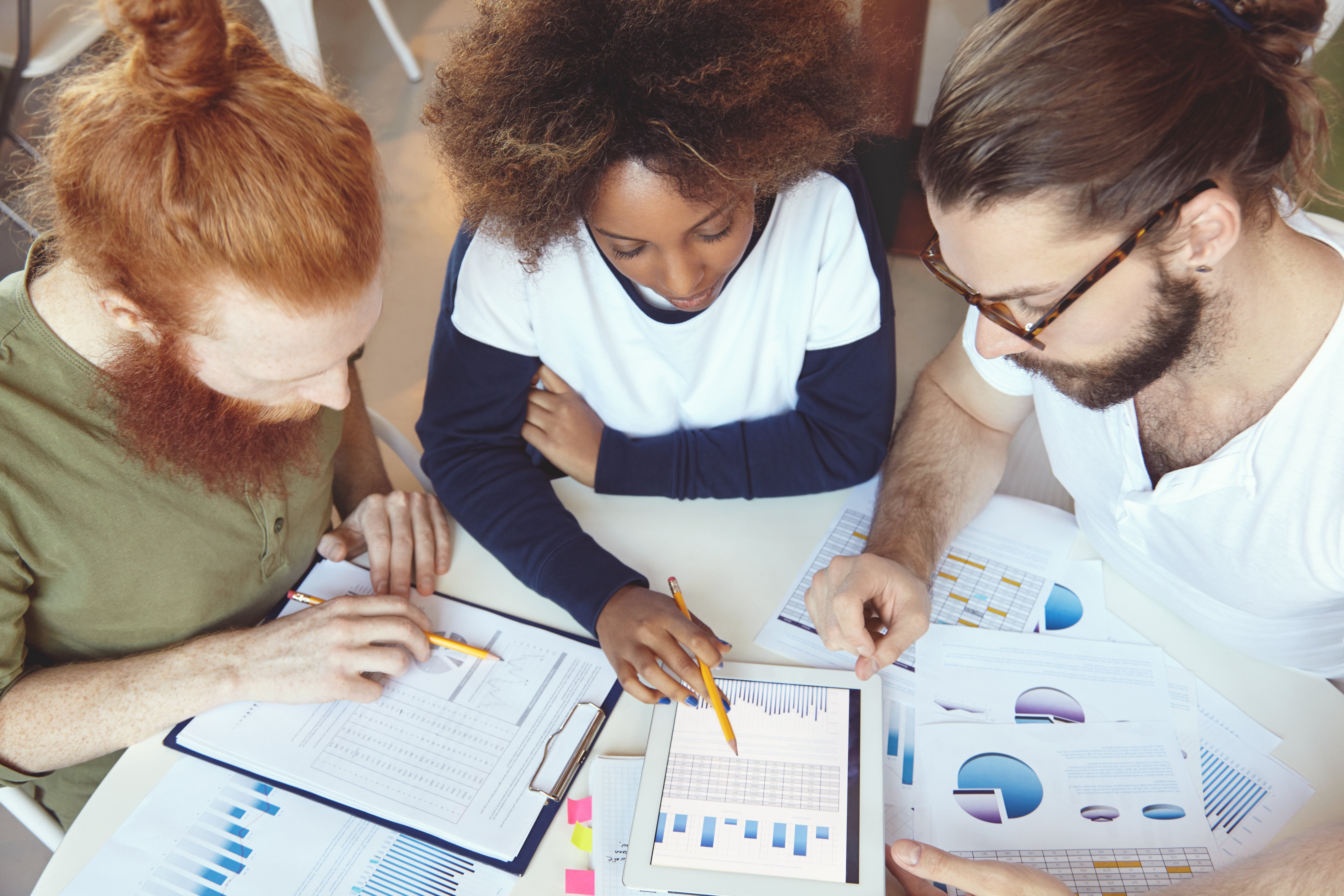 people-working-in-team-top-view-of-partners-discus-NLZJJBG